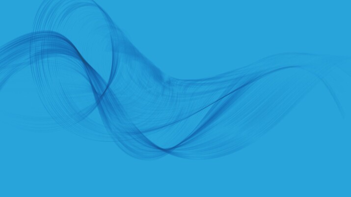 Abstract blue wave-like smoke on a solid blue background.