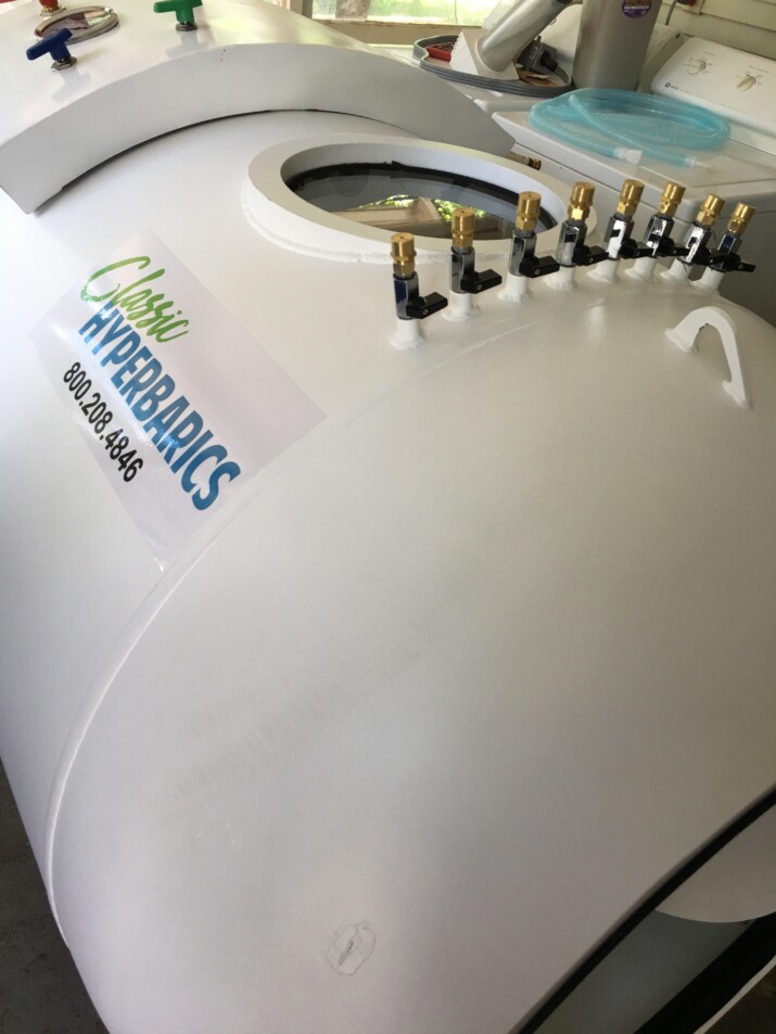 Close-up of an MRI machine's head coil with attached coils.